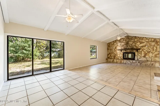 a view of empty room with windows