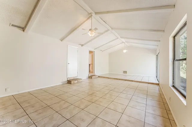 a view of an empty room and window