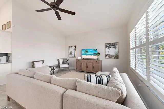 a view of a dining room with furniture wooden floor and chandelier