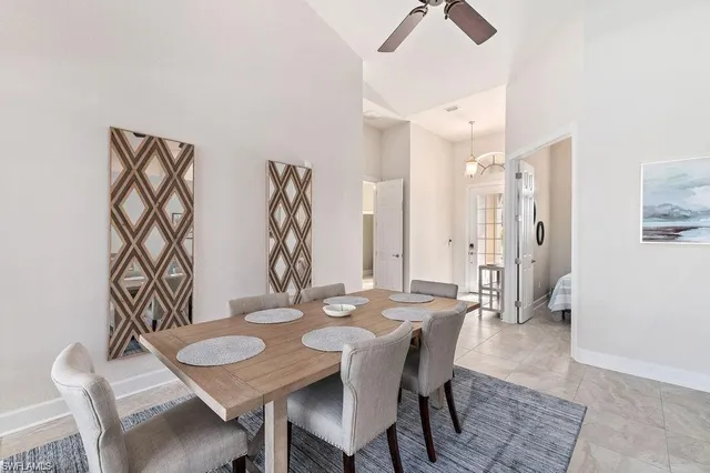 a kitchen with stainless steel appliances granite countertop white cabinets a sink and a stove