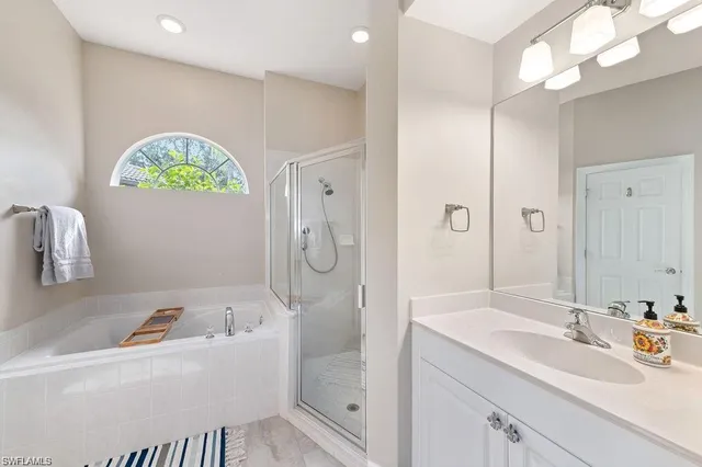 a kitchen with stainless steel appliances a refrigerator a sink a stove and cabinets