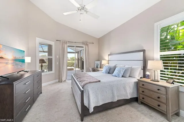 a bedroom with a large bed and a couch