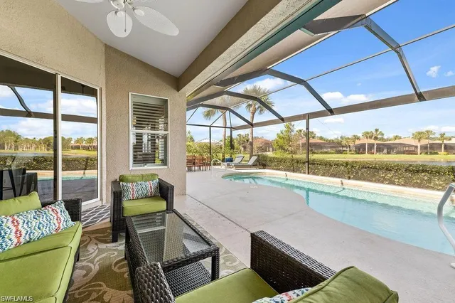 a bedroom with two beds and a chandelier