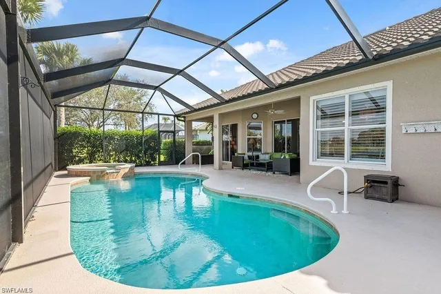 a view of a patio with a table chairs and a backyard