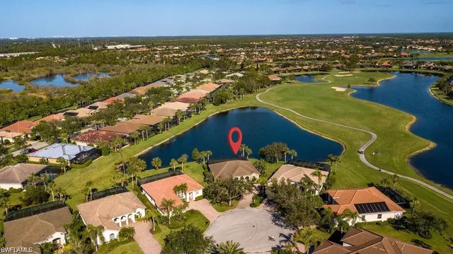 a view of a roof deck with a table and chairs under an umbrella