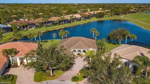 a view of a swimming pool with seating area