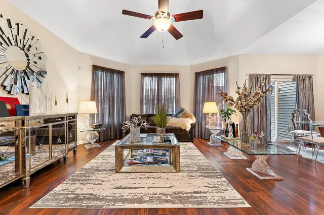 a view of a dining room with furniture wooden floor and chandelier