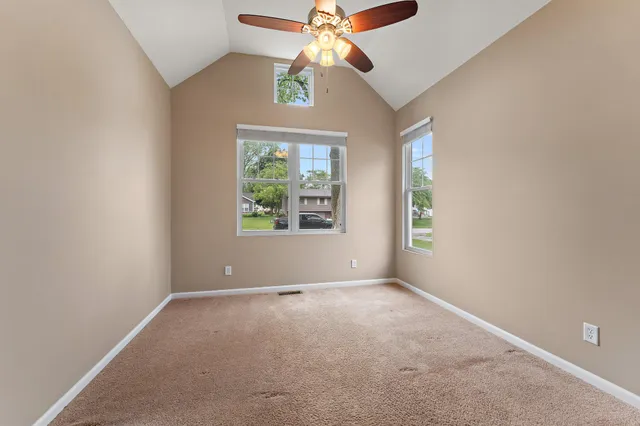 a bedroom with furniture and wooden floor