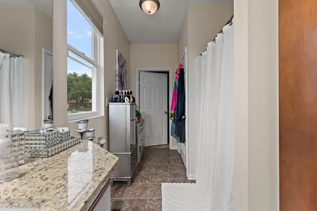 a en suite bathroom with a sink and a mirror