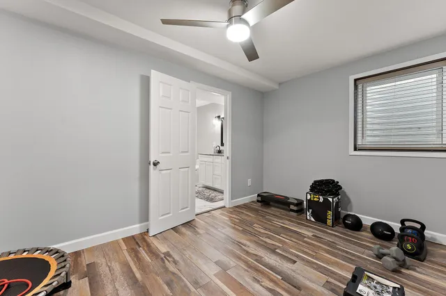 a bedroom with furniture and a window