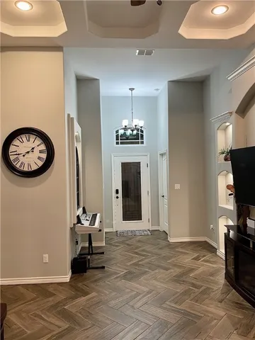 a view of a livingroom with furniture and a ceiling fan