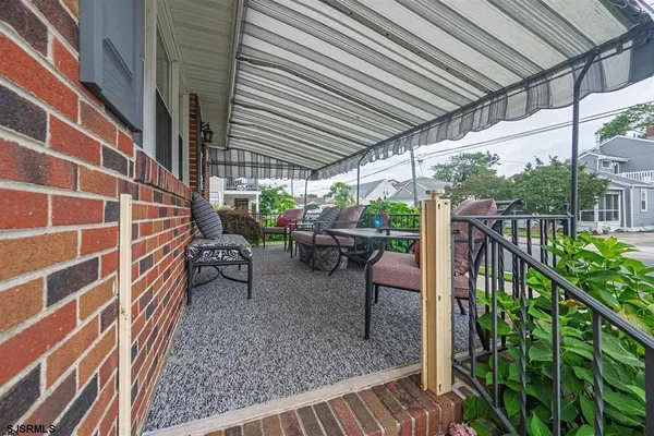a view of a porch with wooden floor