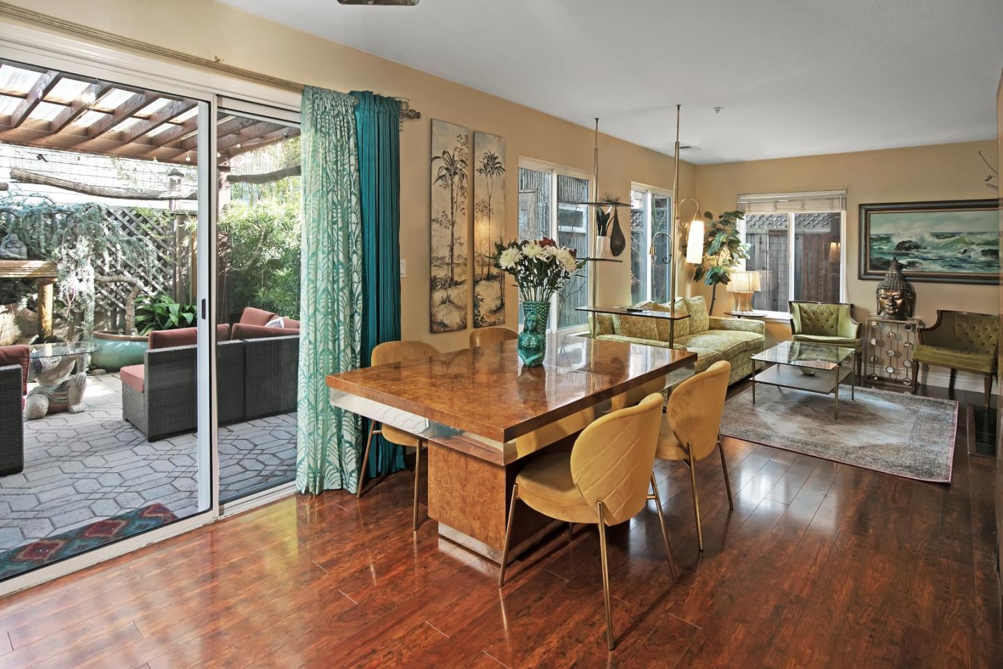 708 Coast Range Drive Scotts Valley, CA 95066 - Photo 13 of 37 a dining room with furniture wooden floor a potted plant and a chandelier