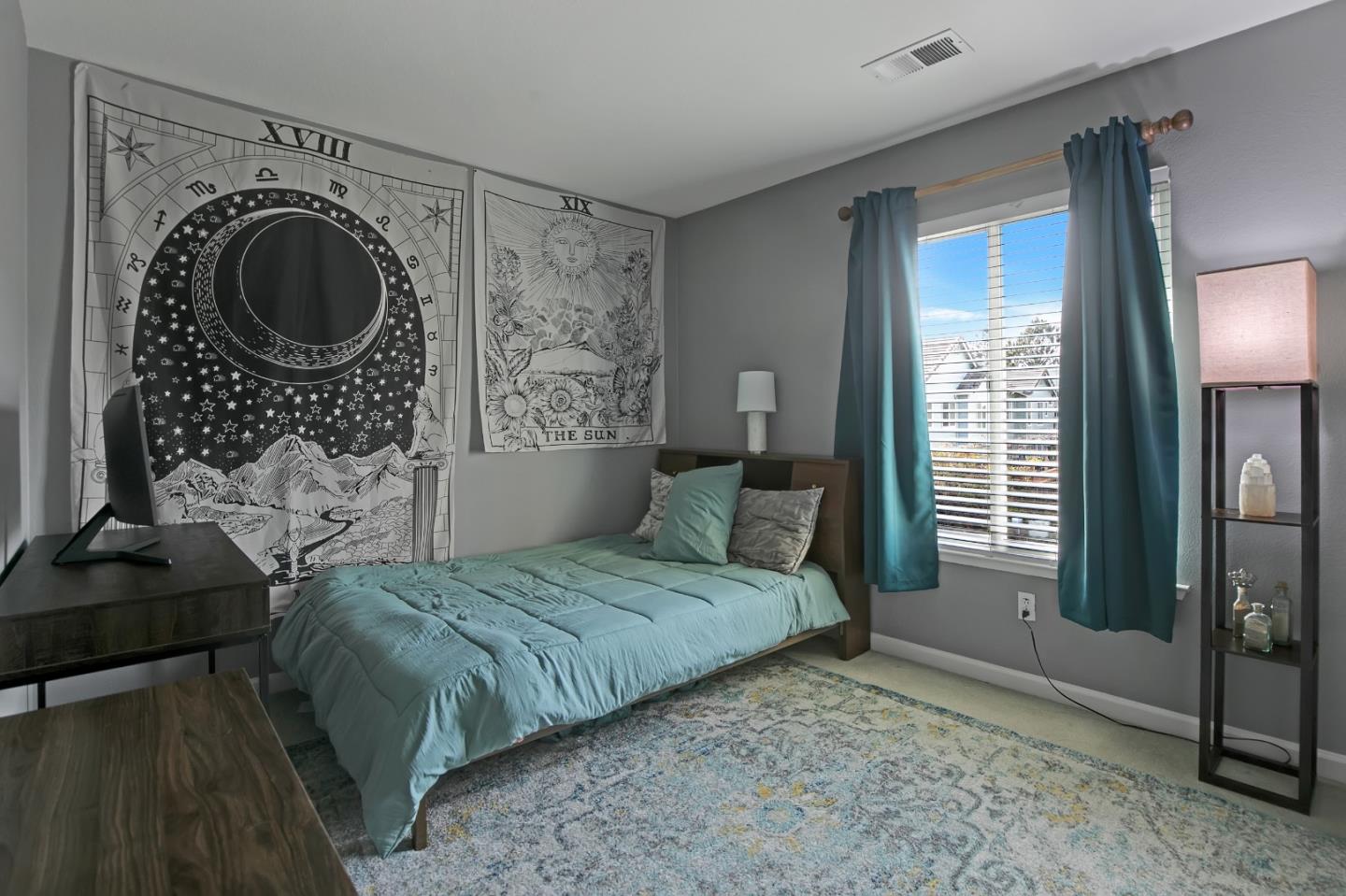 708 Coast Range Drive Scotts Valley, CA 95066 - Photo 23 of 37 a bedroom with a bed a mirror and a window