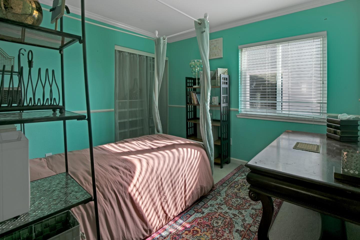 708 Coast Range Drive Scotts Valley, CA 95066 - Photo 24 of 37 a bed sitting in a bedroom next to a window