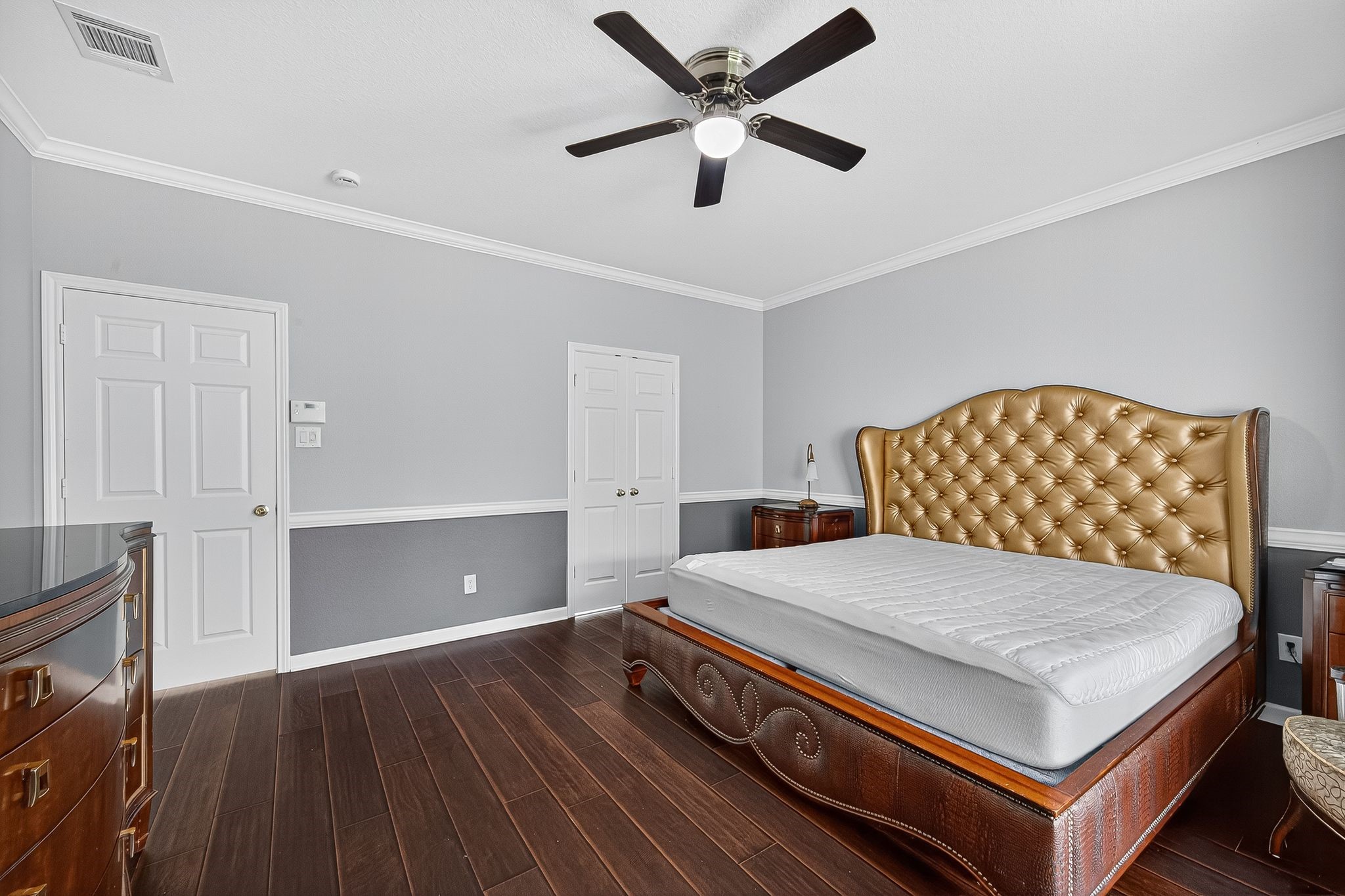 22406 Piper Terrace Lane Katy, TX 77450 - Photo 31 of 44 a bedroom with a bed and a ceiling fan