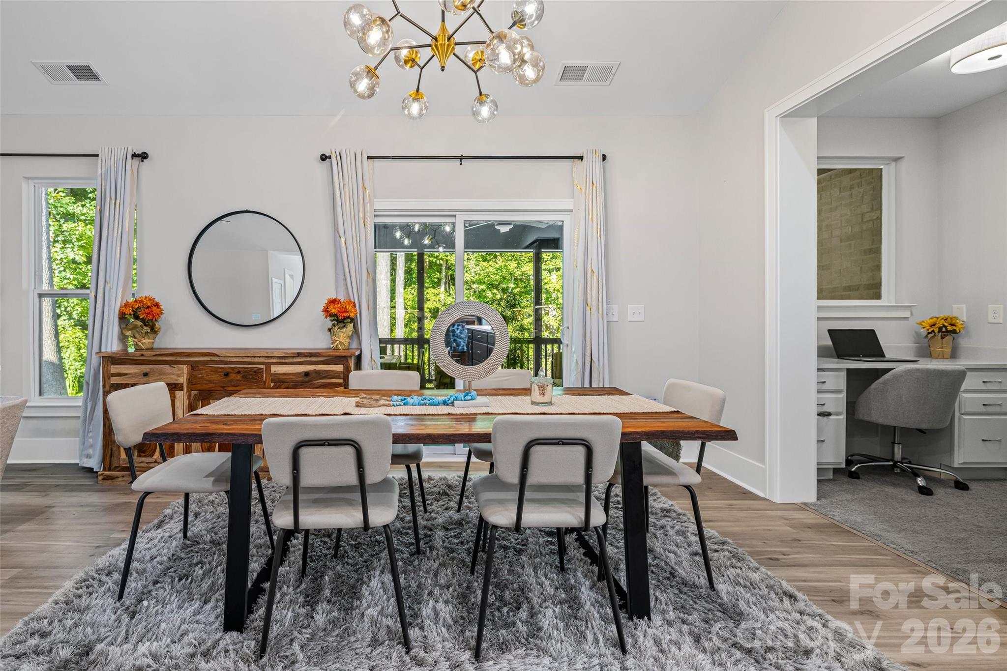 319 Inland Cove Court Clover, SC 29710 - Photo 16 of 47 a view of a dining room with furniture window and wooden floor