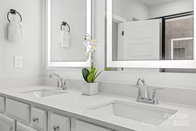 a bathroom with a sink and a window