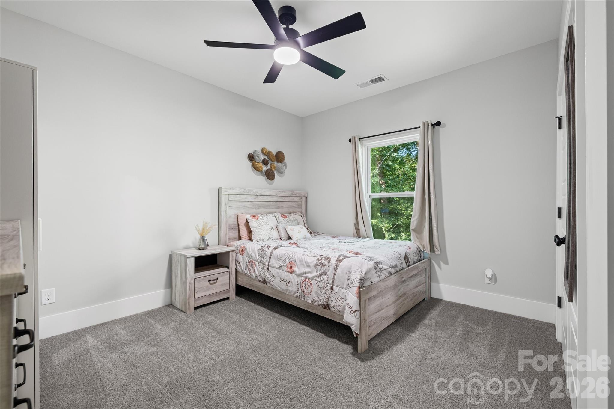 319 Inland Cove Court Clover, SC 29710 - Photo 30 of 47 a bedroom with a bed and a ceiling fan