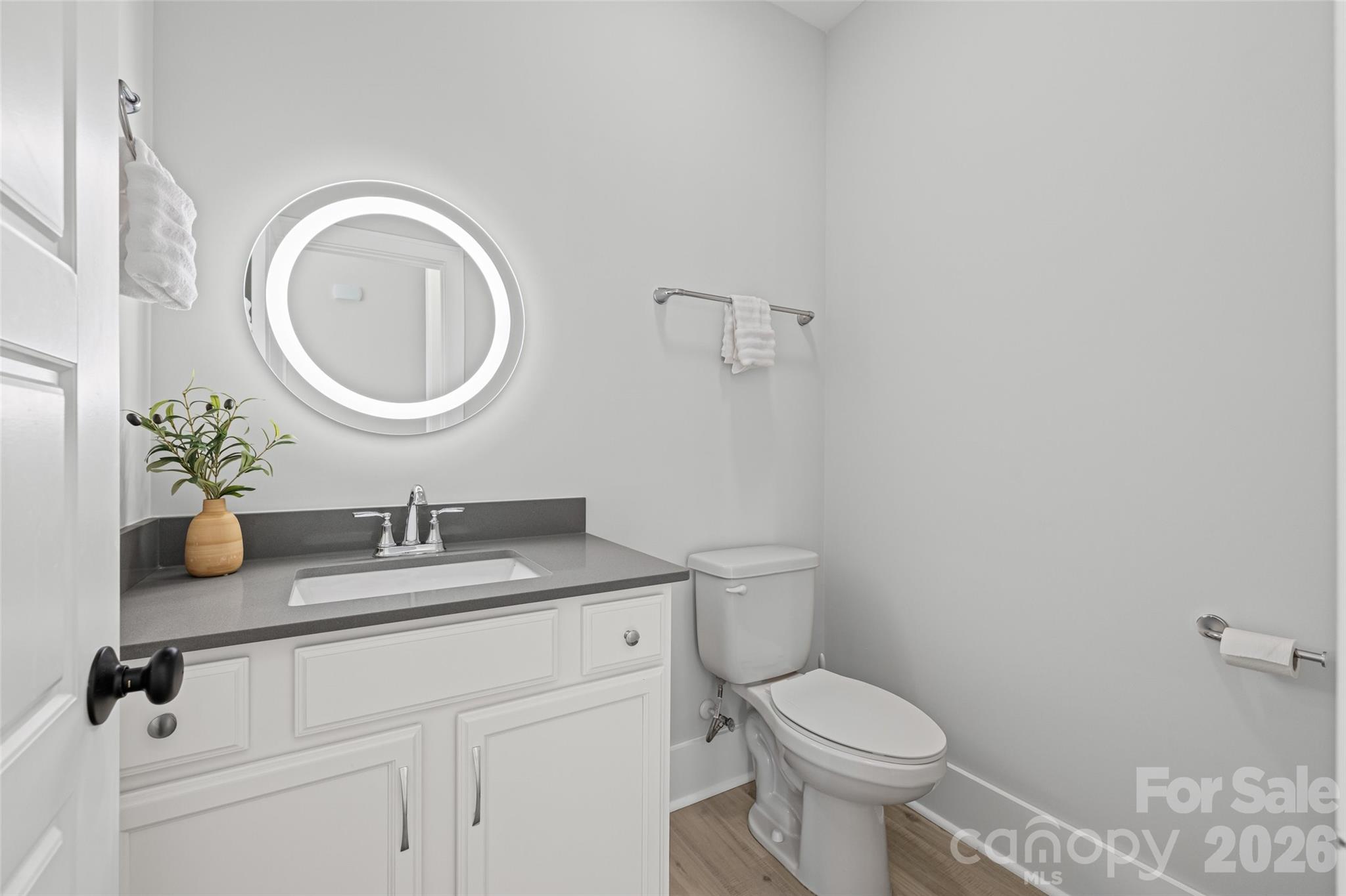 319 Inland Cove Court Clover, SC 29710 - Photo 33 of 47 a bathroom with a granite countertop toilet a sink and a mirror
