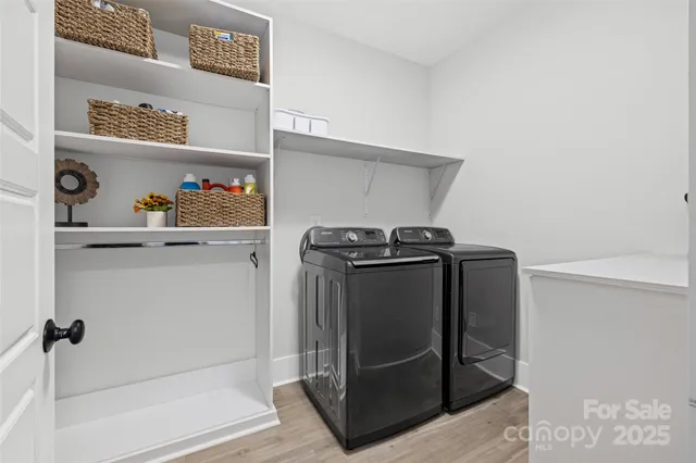 a utility room with washer and dryer