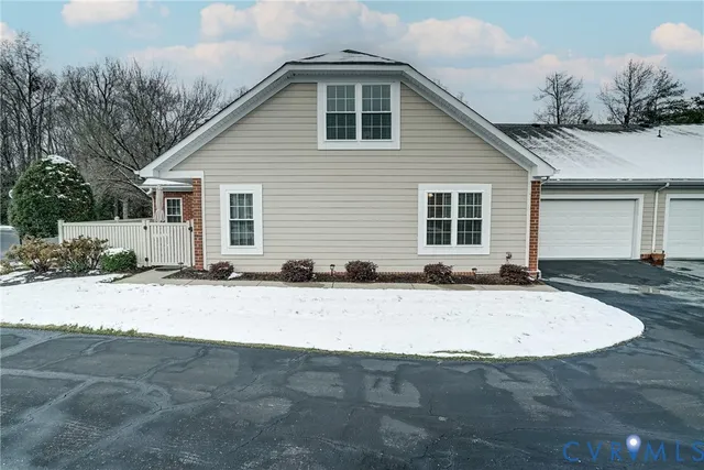 a view of a house with snow on the road