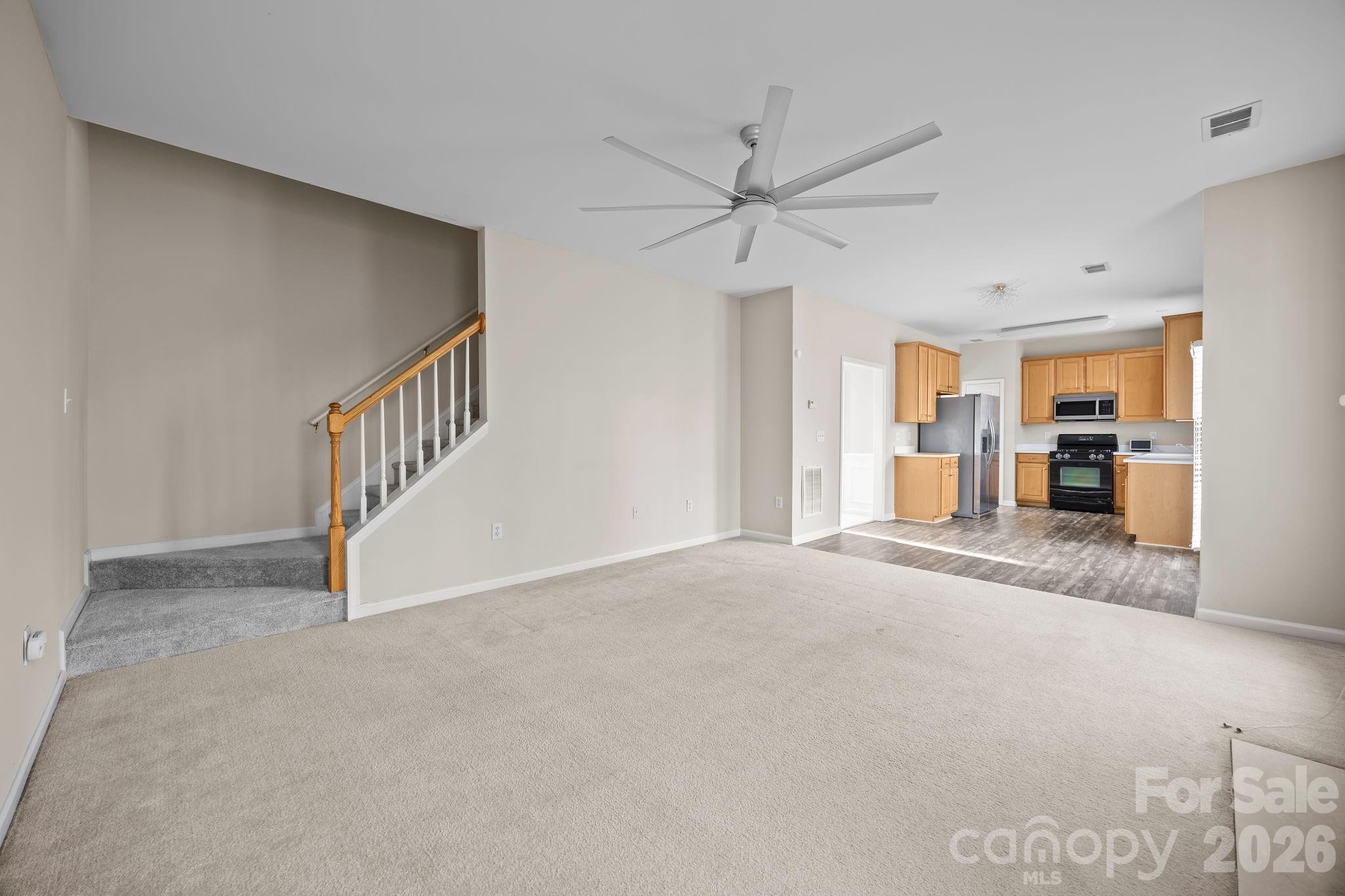 3203 Arklow Road Charlotte, NC 28269 - Photo 14 of 44 a view of a livingroom with a staircase