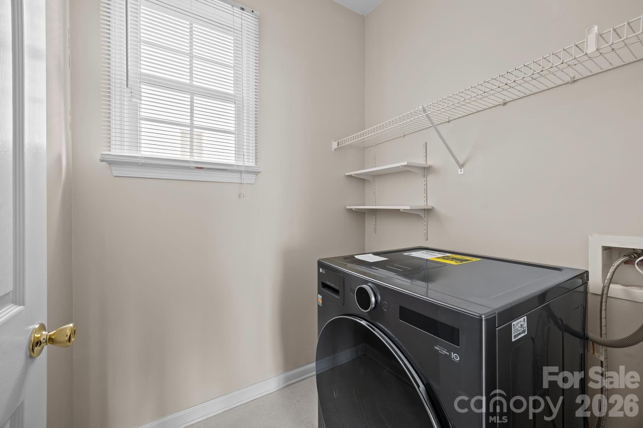 3203 Arklow Road Charlotte, NC 28269 - Photo 15 of 44 a utility room with dryer and washer