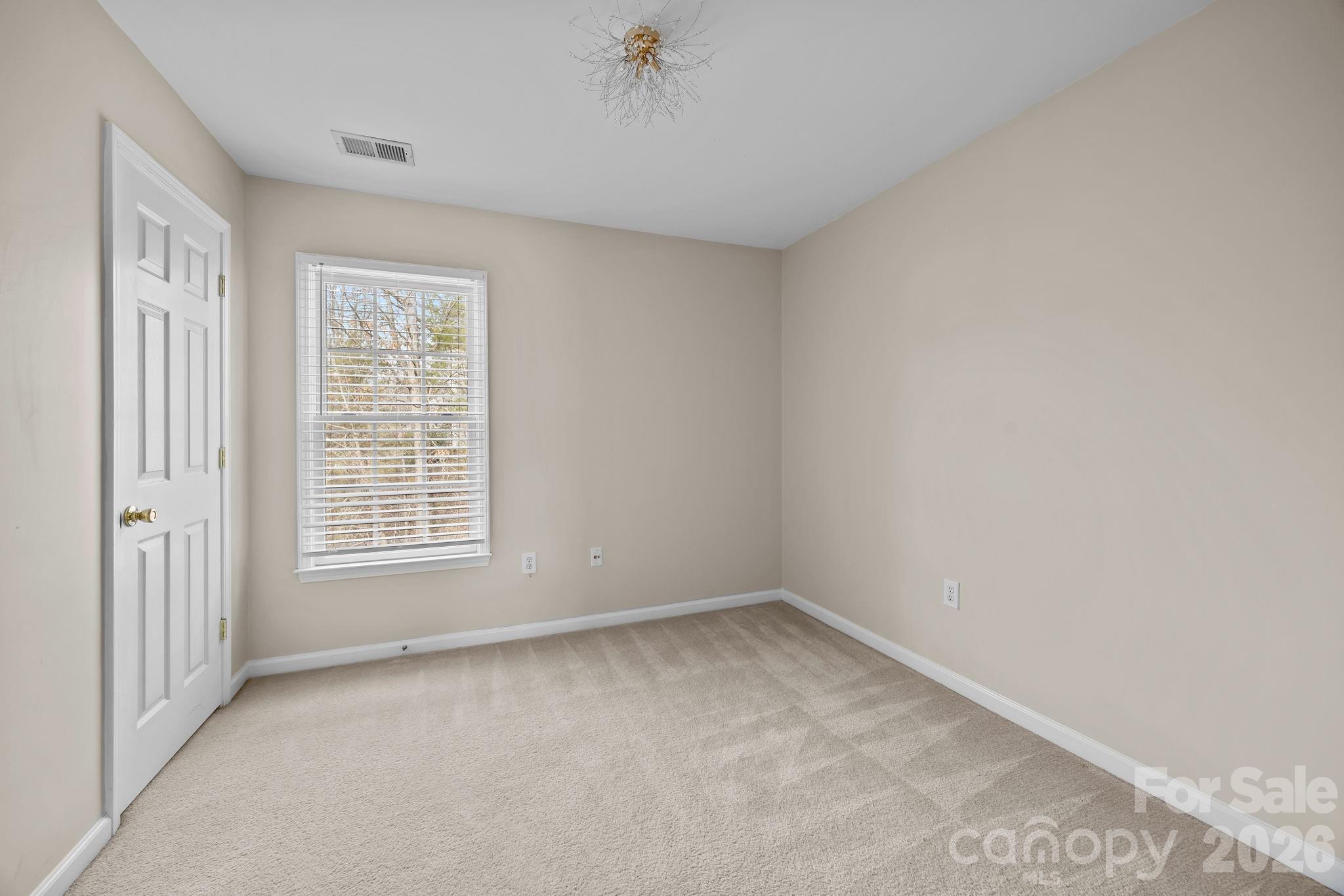 3203 Arklow Road Charlotte, NC 28269 - Photo 28 of 44 an empty room with a window