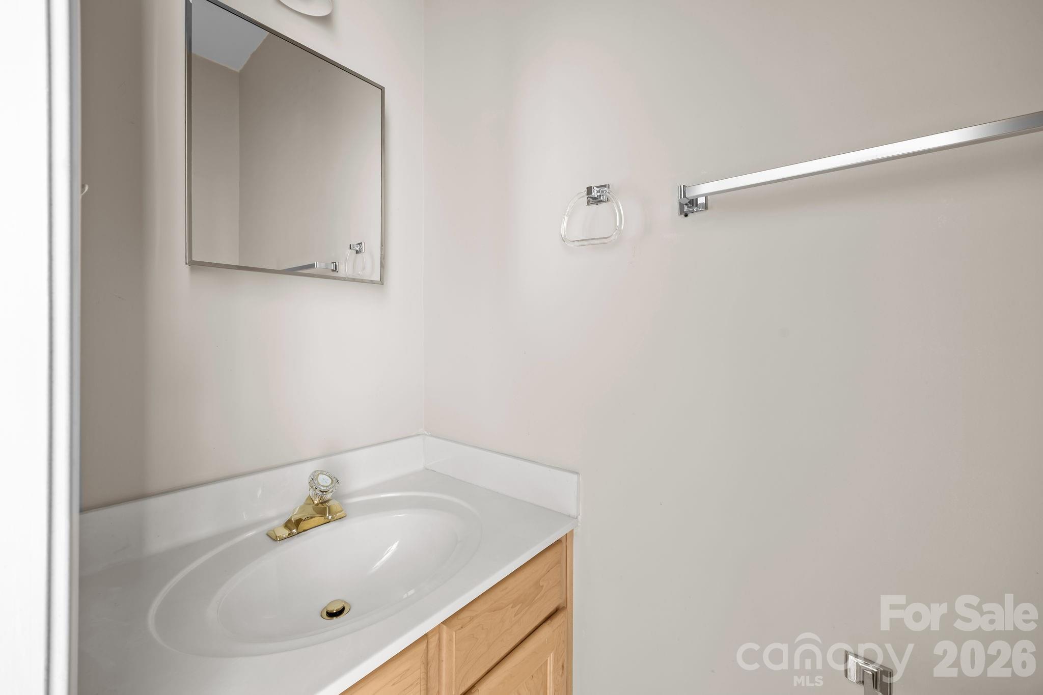 3203 Arklow Road Charlotte, NC 28269 - Photo 31 of 44 a bathroom with a sink and a vanity