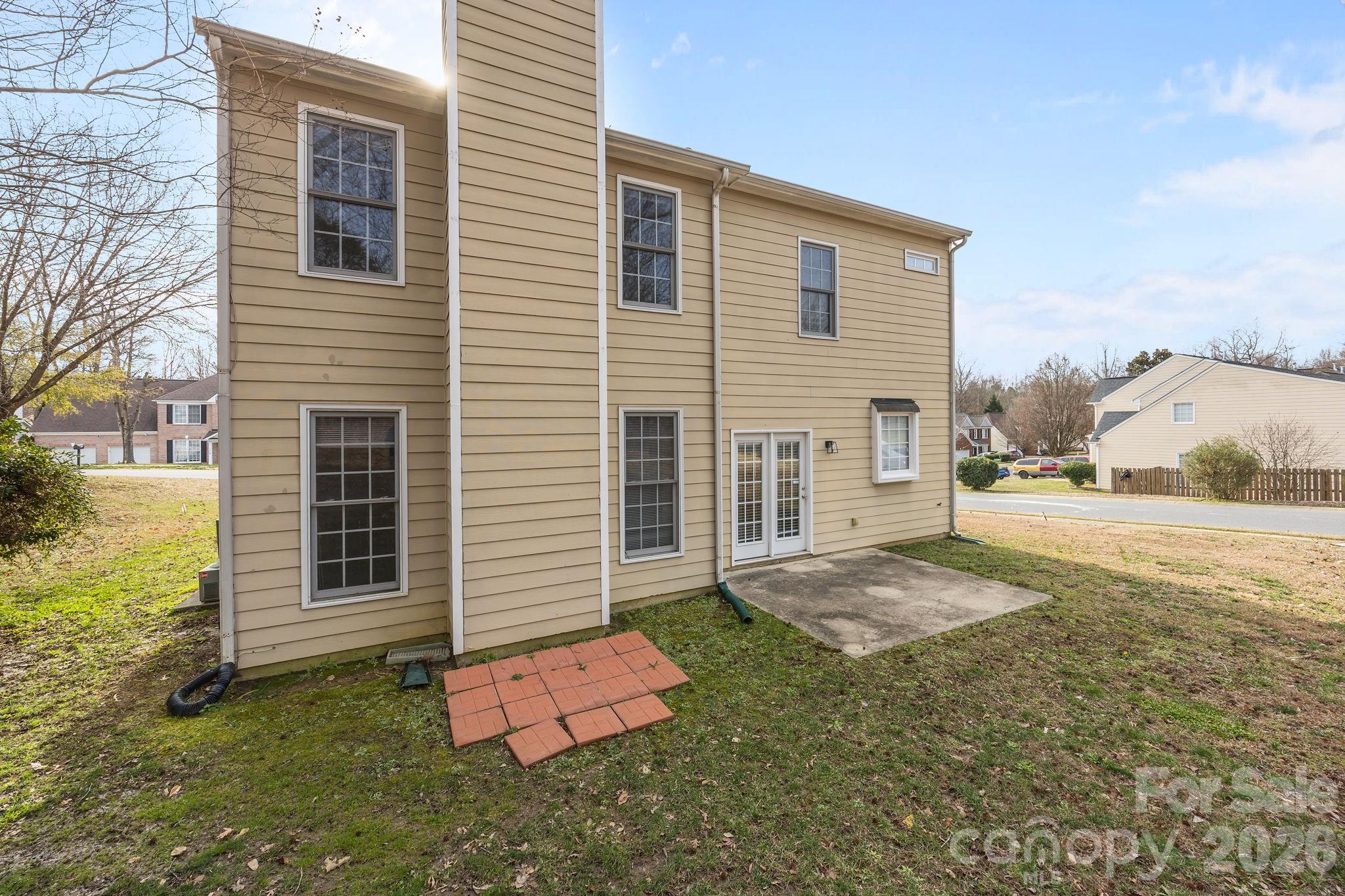 3203 Arklow Road Charlotte, NC 28269 - Photo 32 of 44 a backyard of a house with yard and seating space