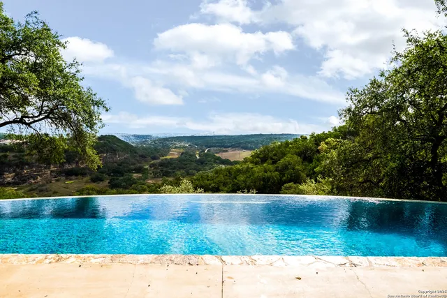 an aerial view of houses with yard