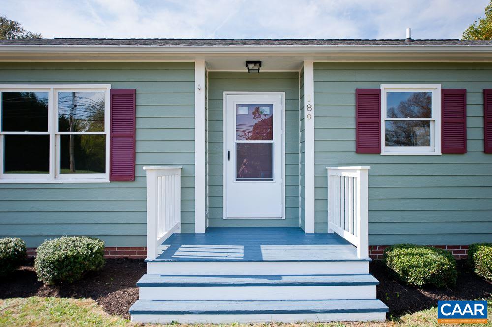 189 Stephens Loop Ruckersville, VA 22968 - Photo 2 of 20 a front view of a house with potted plants