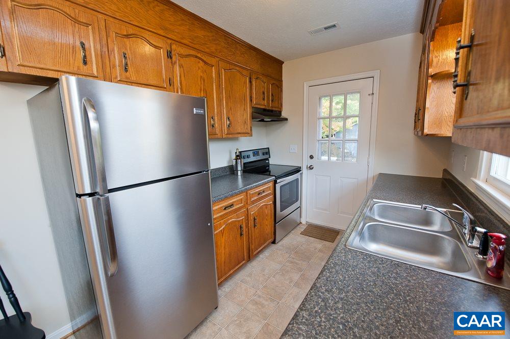 189 Stephens Loop Ruckersville, VA 22968 - Photo 9 of 20 a kitchen with stainless steel appliances granite countertop a refrigerator a stove a sink a microwave and cabinets