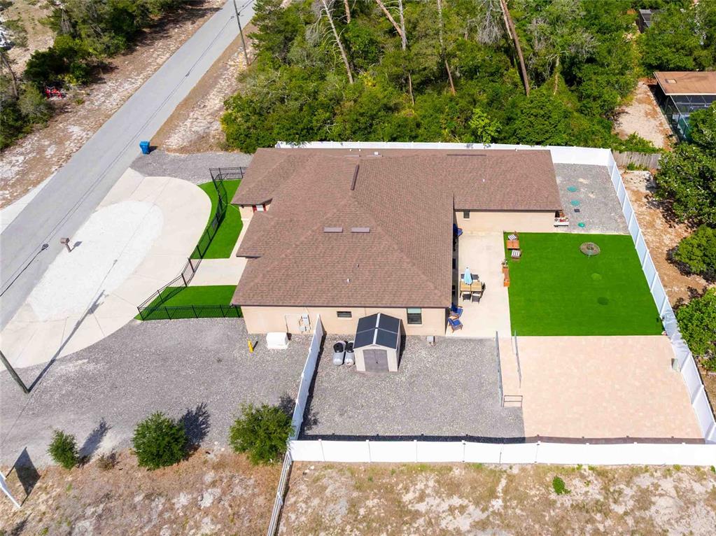 Undisclosed Address Spring Hill, FL 34608 - Photo 38 of 39 an aerial view of a house with a yard