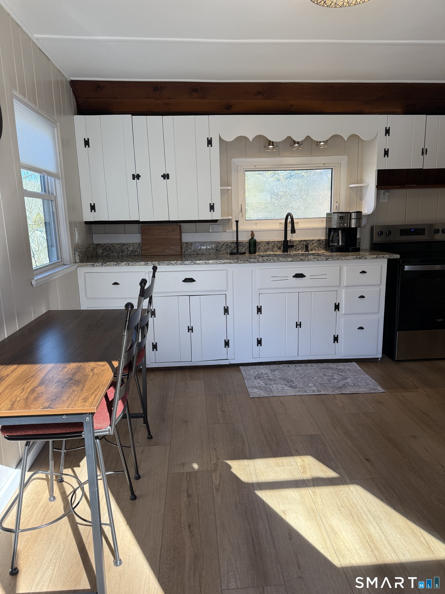 27 Dilliston Road New Hartford, CT 06057 - Photo 6 of 43 a kitchen with granite countertop a stove a sink and a granite counter tops