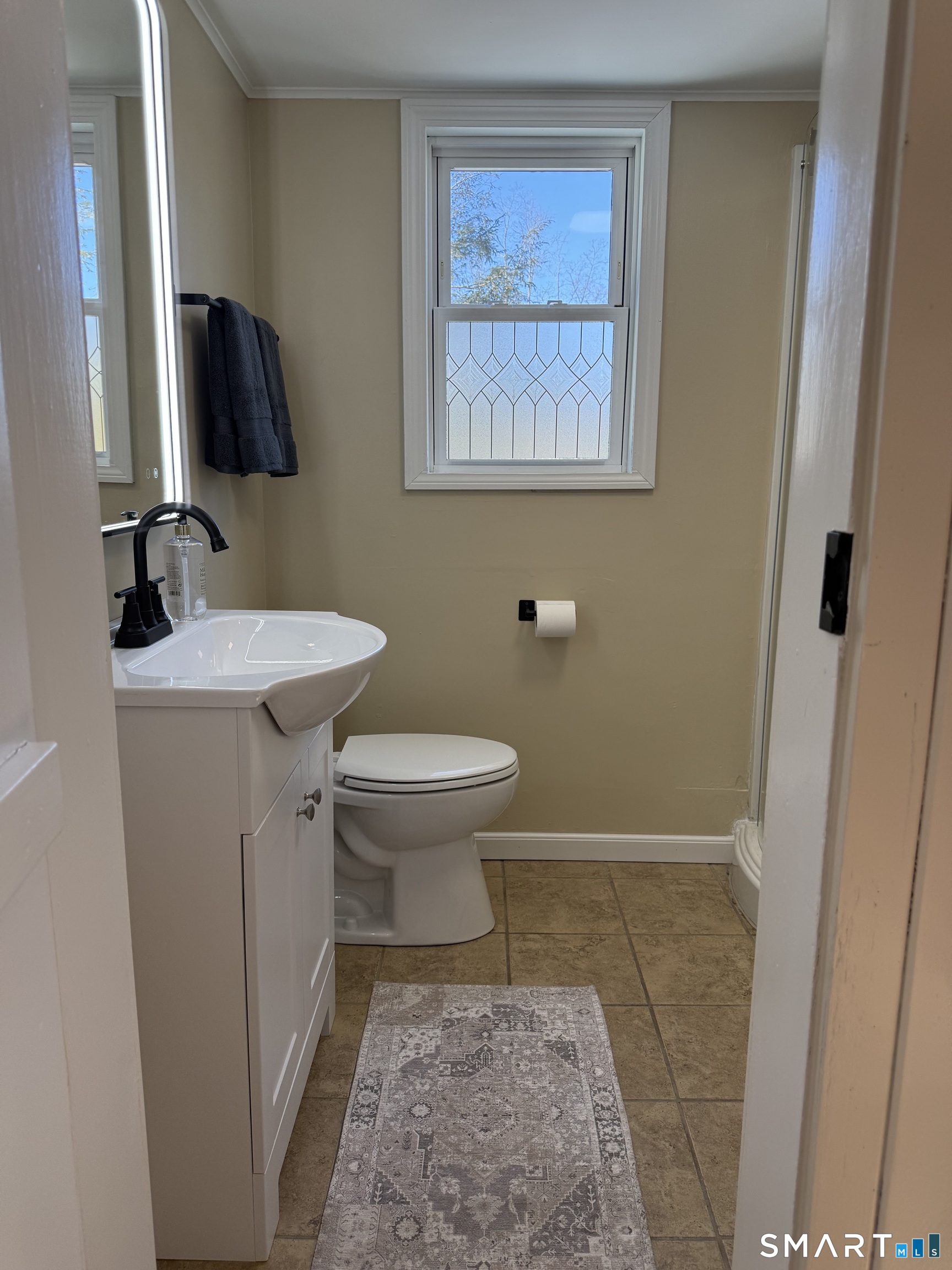 27 Dilliston Road New Hartford, CT 06057 - Photo 10 of 43 a bathroom with a toilet sink and mirror