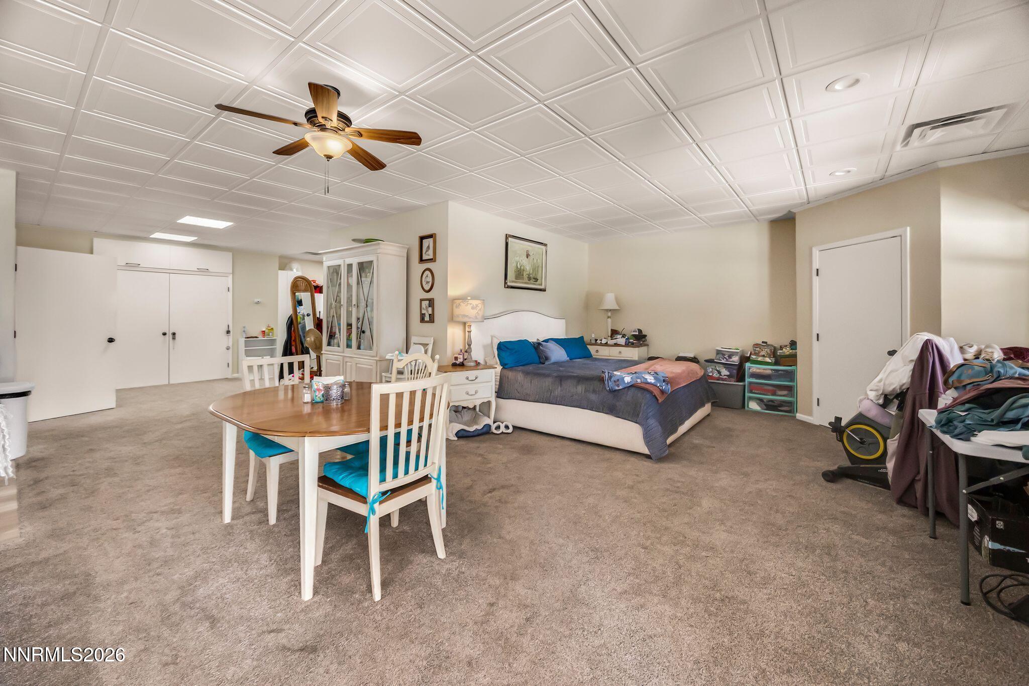 250 Jacks Valley Ranch Road Carson City, NV 89705 - Photo 24 of 44 a living room with furniture gym equipment and a ceiling fan