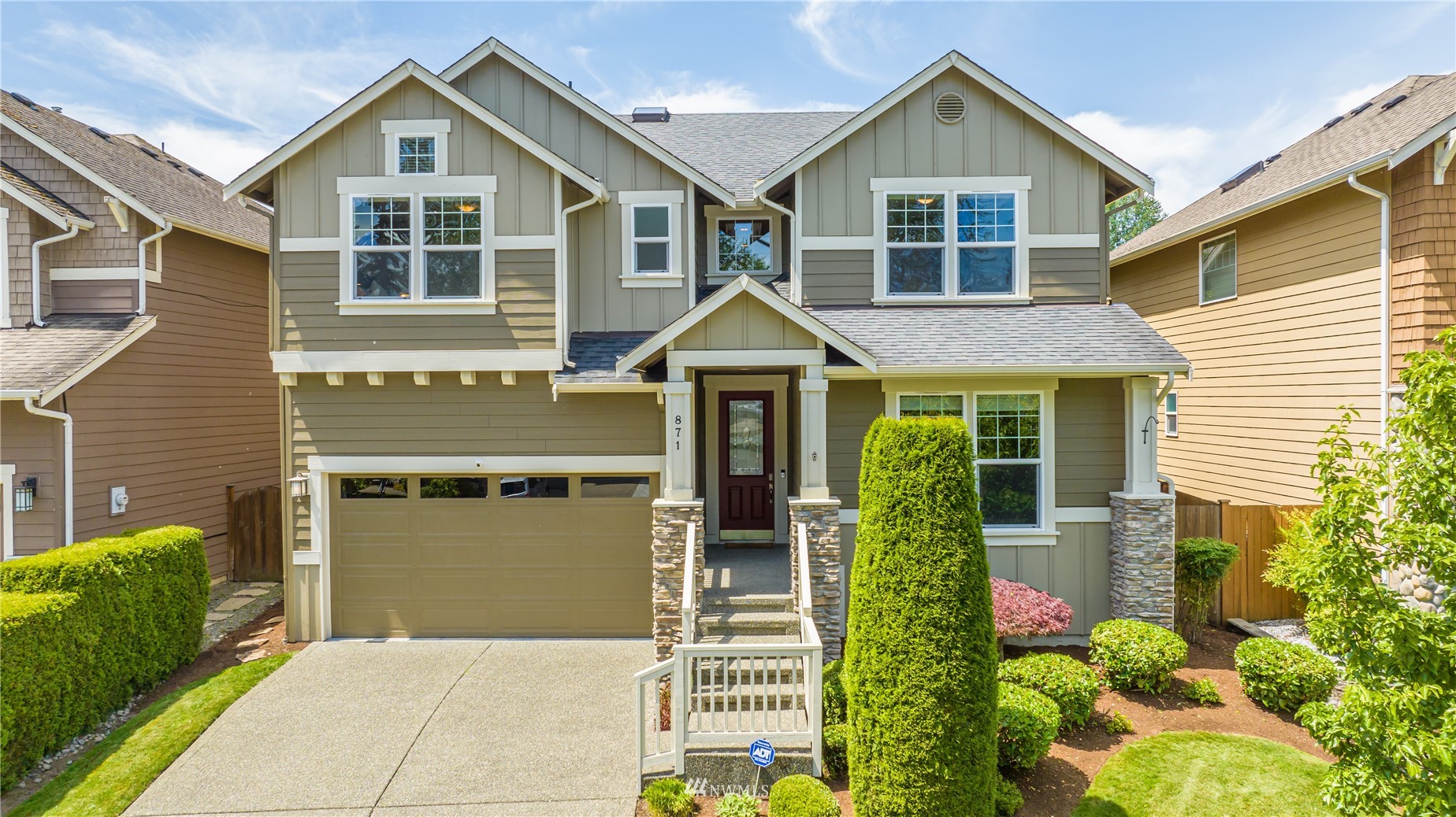 871 Jericho Place Northeast Renton, WA 98059 - Photo 1 of 31 a front view of a house with garden