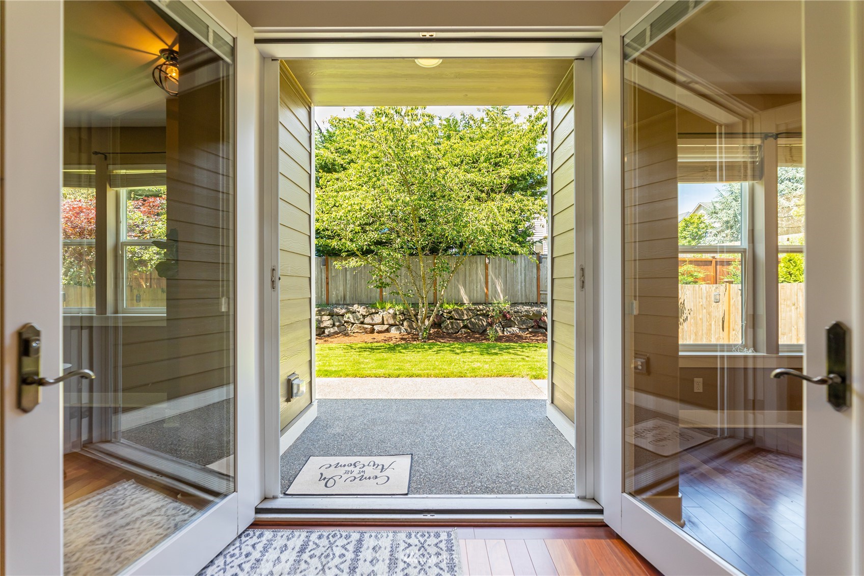 871 Jericho Place Northeast Renton, WA 98059 - Photo 25 of 31 a view of a glass door with a yard