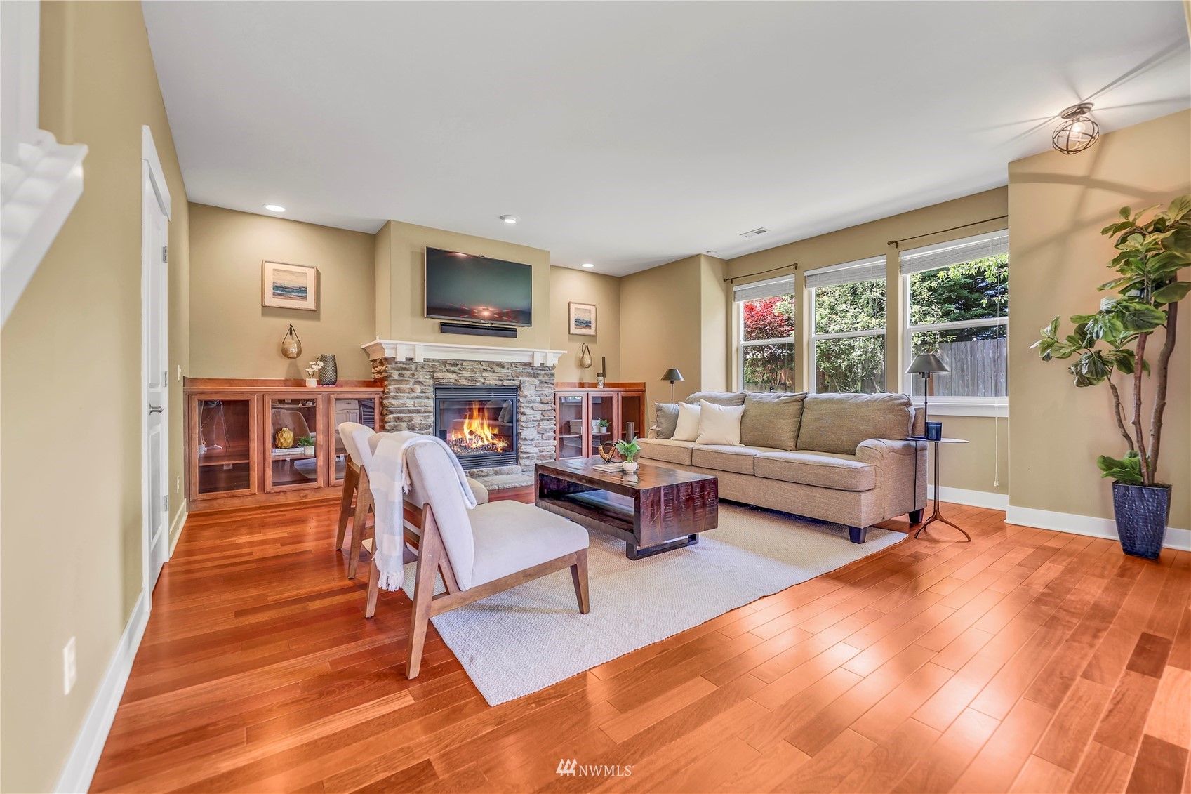 871 Jericho Place Northeast Renton, WA 98059 - Photo 9 of 31 a living room with furniture and a wooden floor