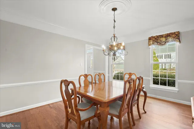 a kitchen with granite countertop a sink a stove and cabinets