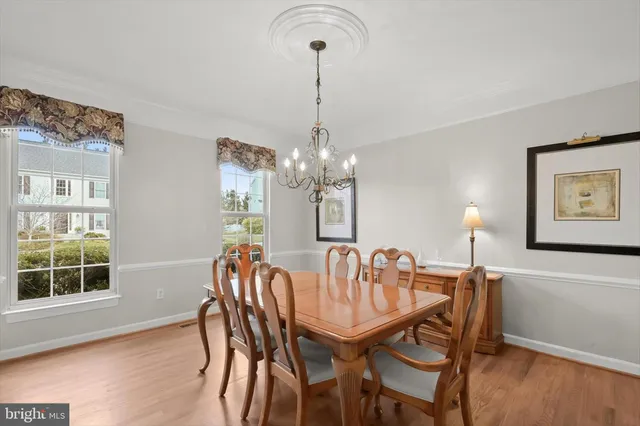 a kitchen with stainless steel appliances granite countertop wooden cabinets stove top oven and sink