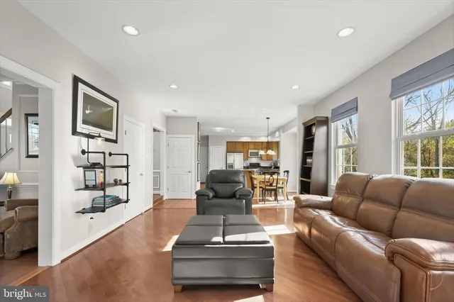 a bathroom with a granite countertop sink mirror and bathtub