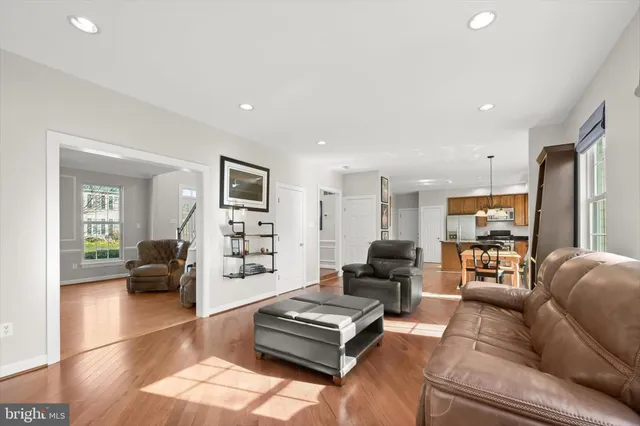 a living room with furniture a window and a chair