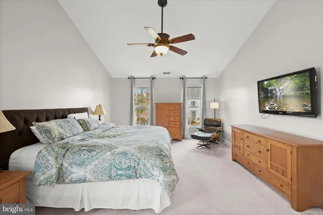 a view of an empty room with a window and fireplace