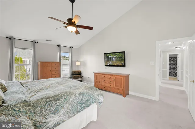 a view of empty room with kitchen