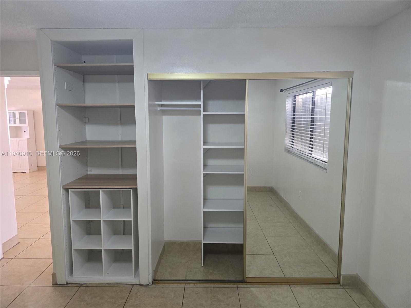 2775 West 61st Street, Unit 203 Hialeah, FL 33016 - Photo 5 of 8 a view of an empty room with a closet