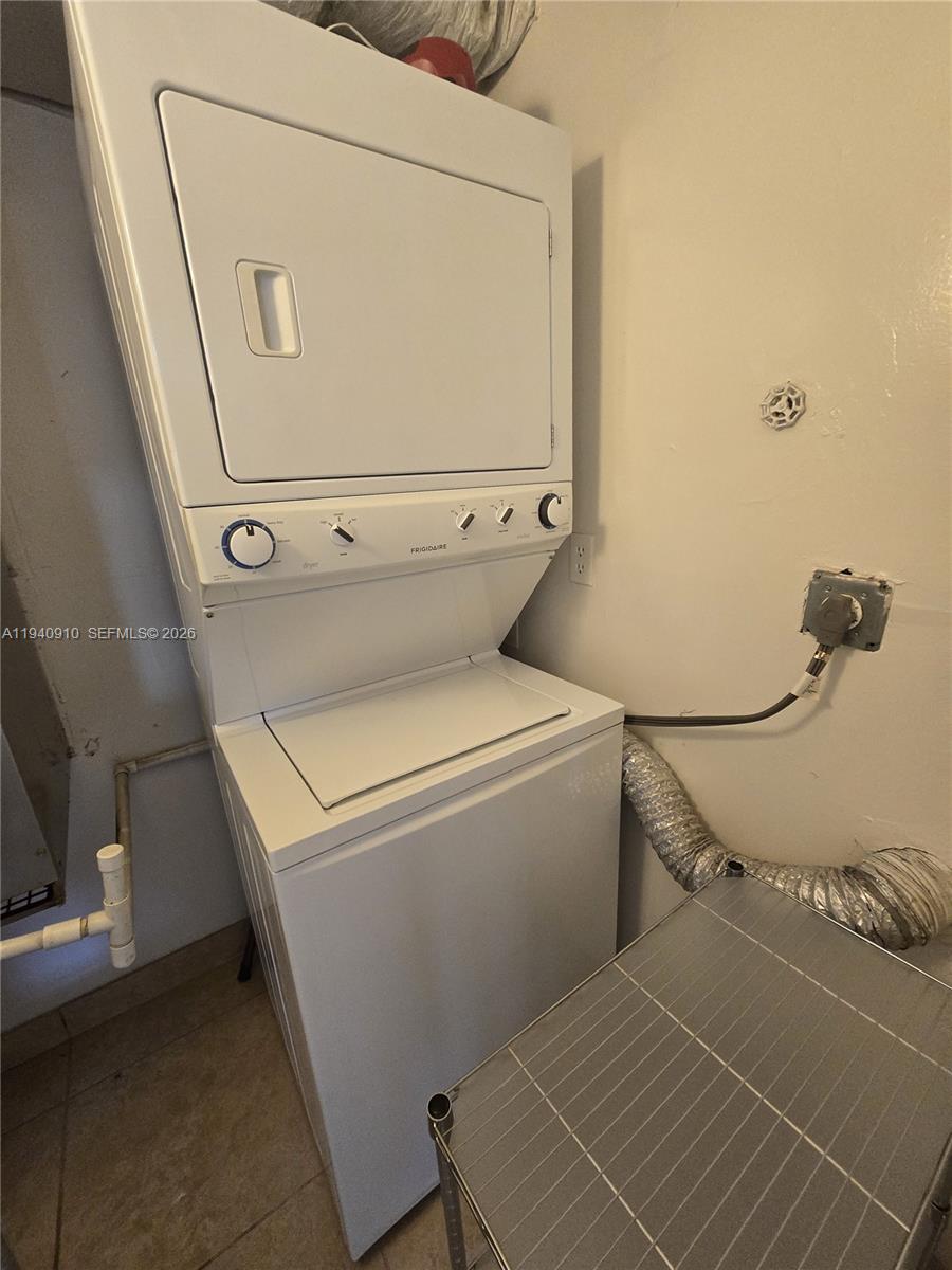 2775 West 61st Street, Unit 203 Hialeah, FL 33016 - Photo 8 of 8 a utility room with dryer and washer