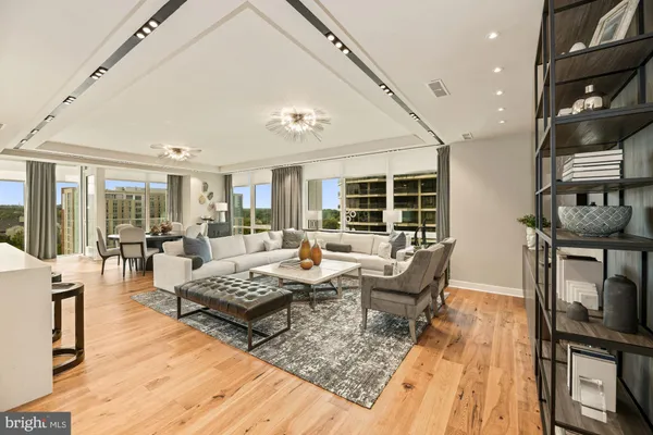 a living room with fireplace furniture and a wooden floor